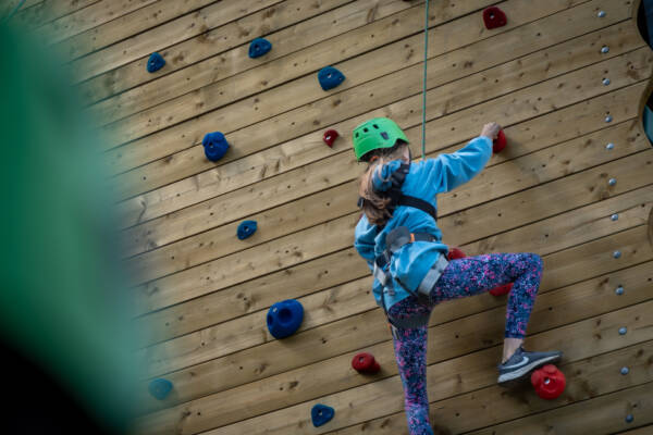 Girl climbing a wall